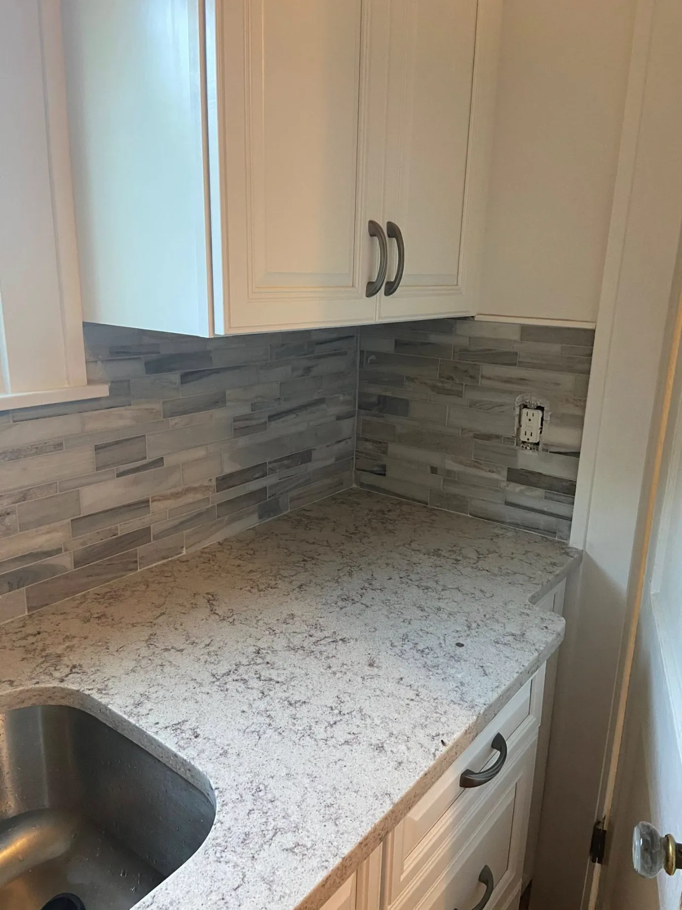 Fresh grout being applied to ceramic tile by Dmtilellc repair crew